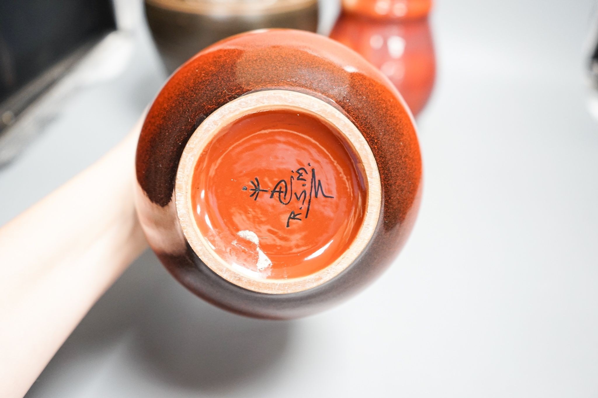 A group of studio pottery including a jar and cover, probably Norah Braden, 25 cm